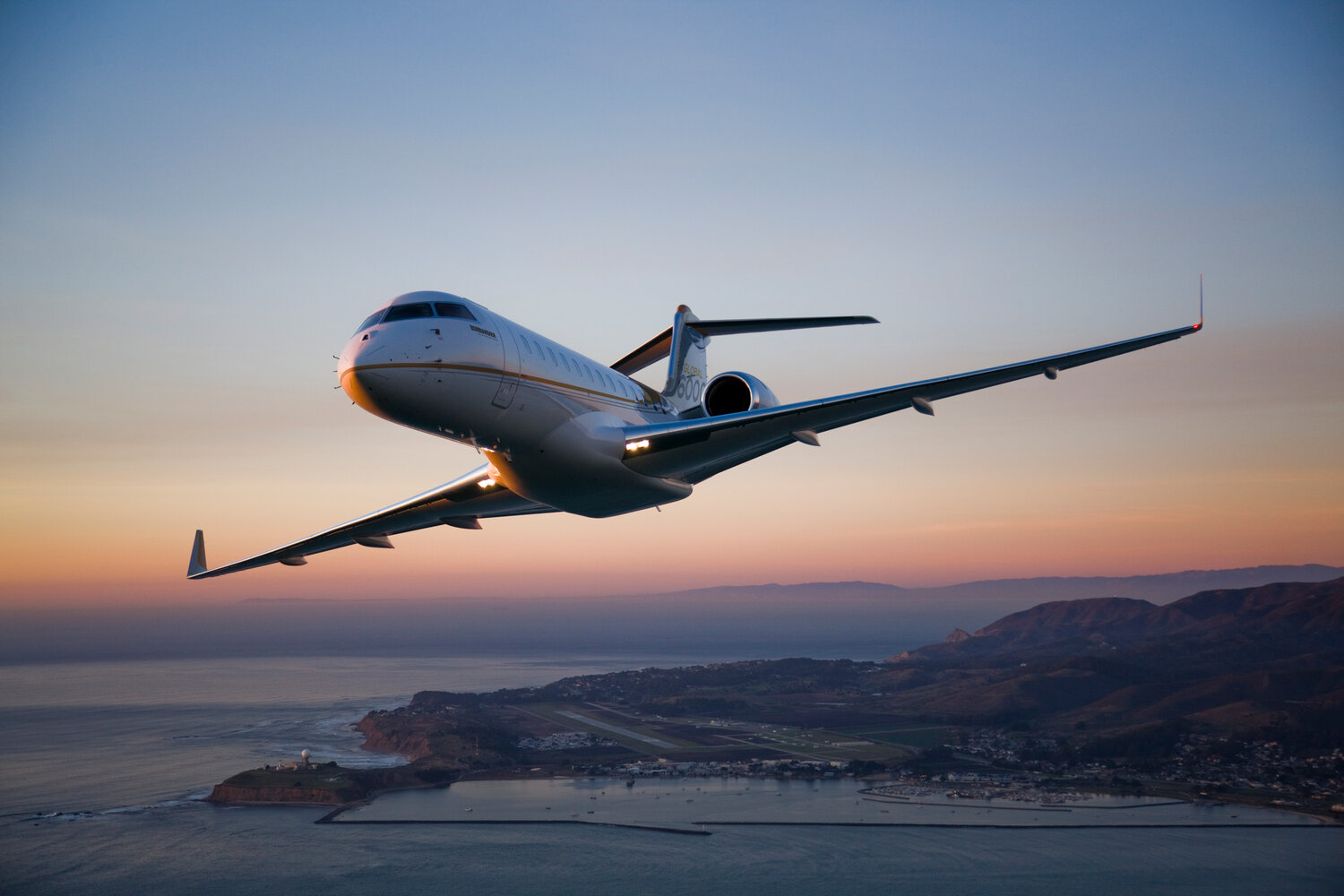 discover how much a private flight costs - private jet flying at sunset